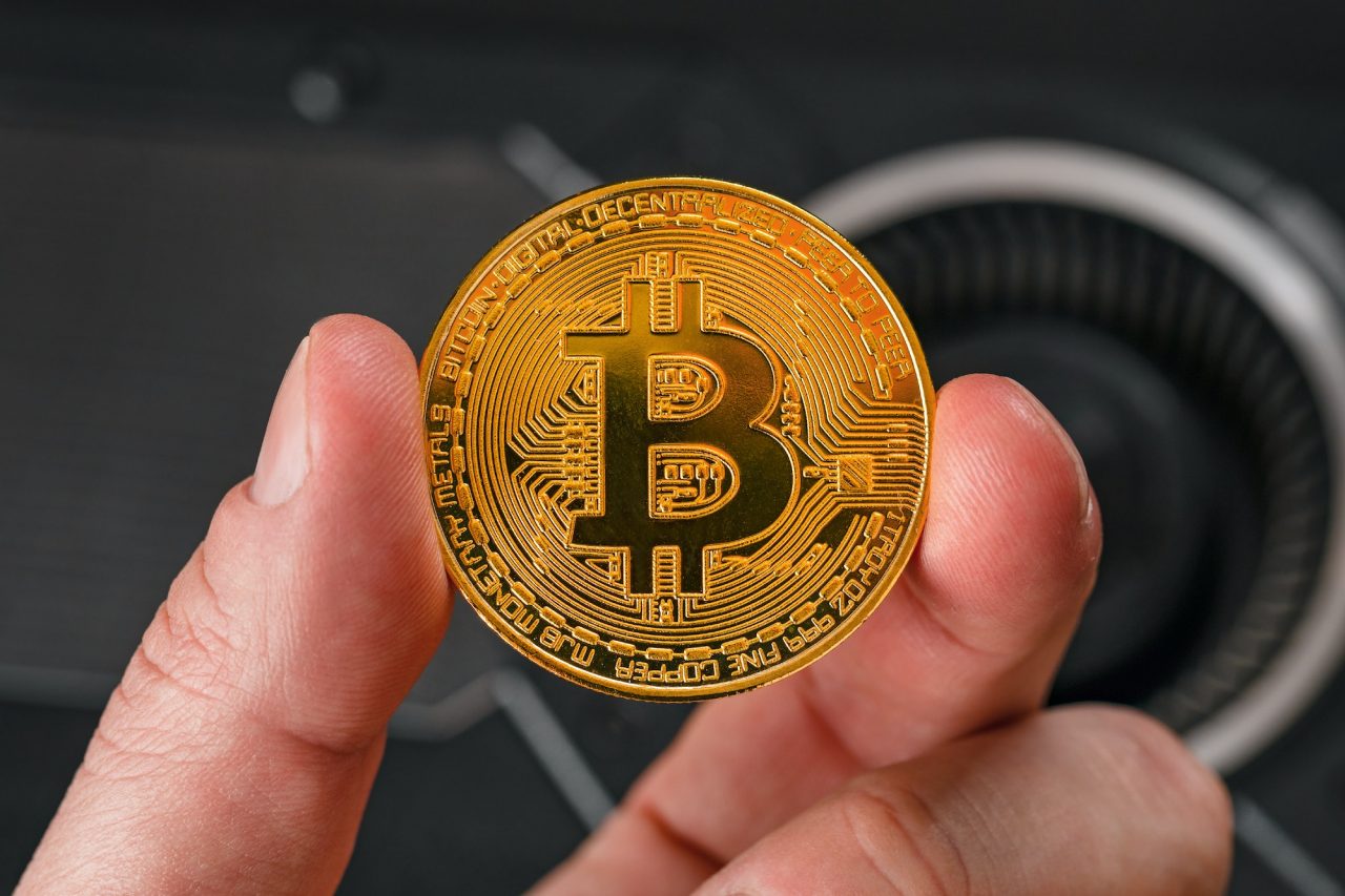 Closeup Of Hand Holding Bitcoin Crypto Currency Coin